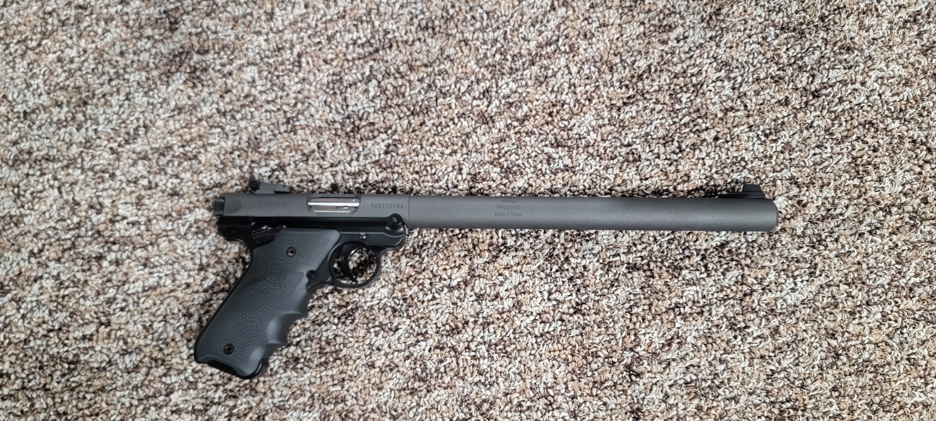 pistol with suppressor attached